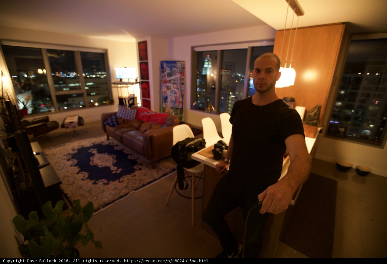 Man in a Modern Living Room Overlooking the City