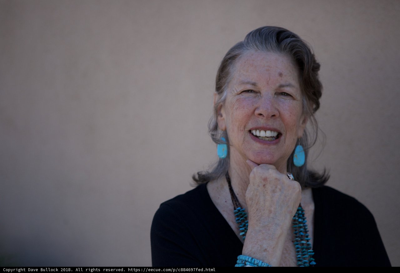 Blue Earrings and a Radiant Smile