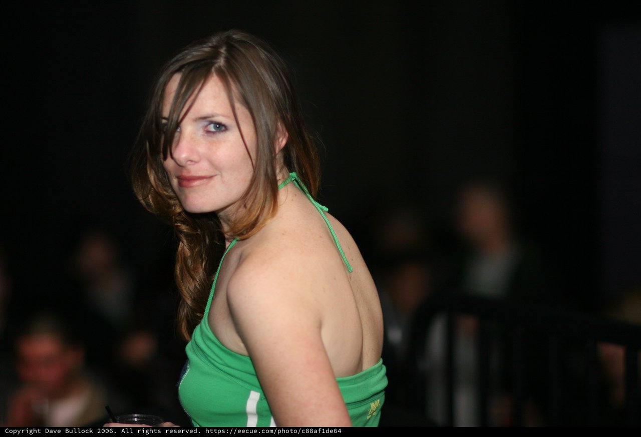 Woman in Green Halter Top at Evening Event