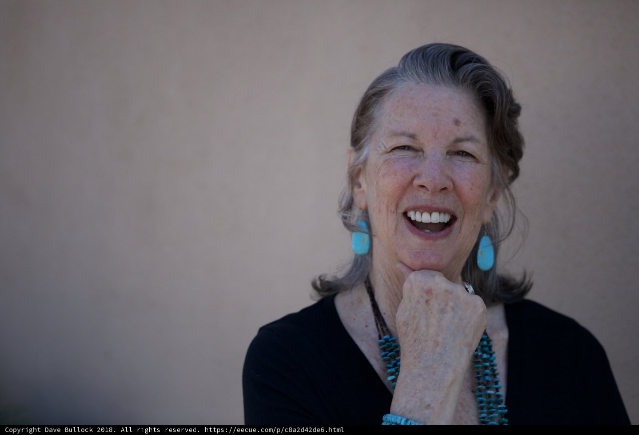 Blue Earrings and a Black Smile