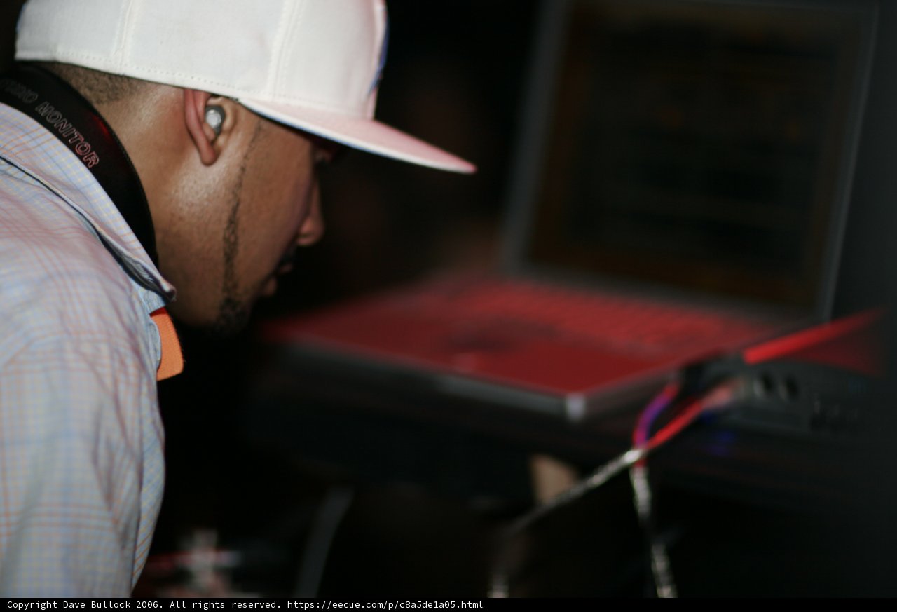 Man in White Hat Working on Laptop