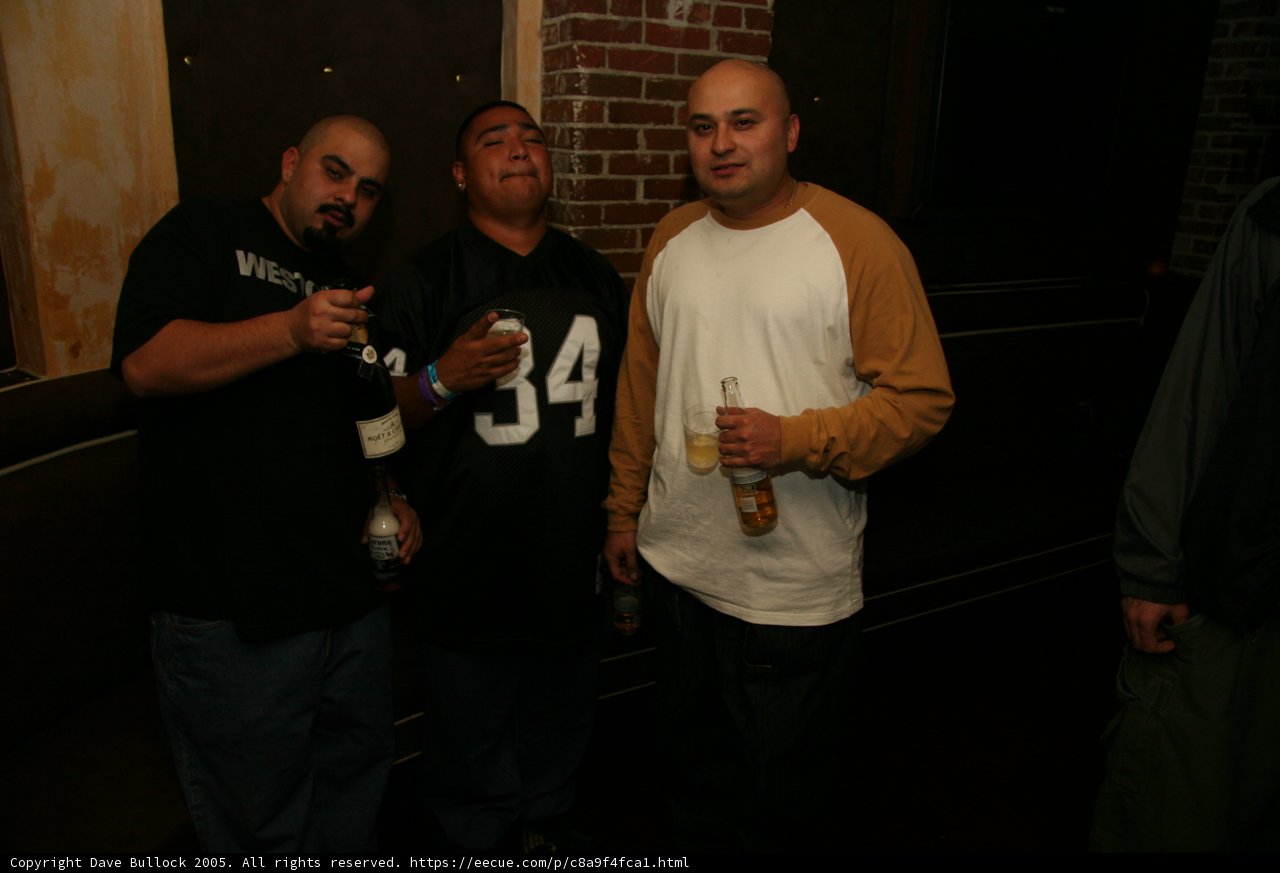 Three Men Enjoying Night Out at Pub