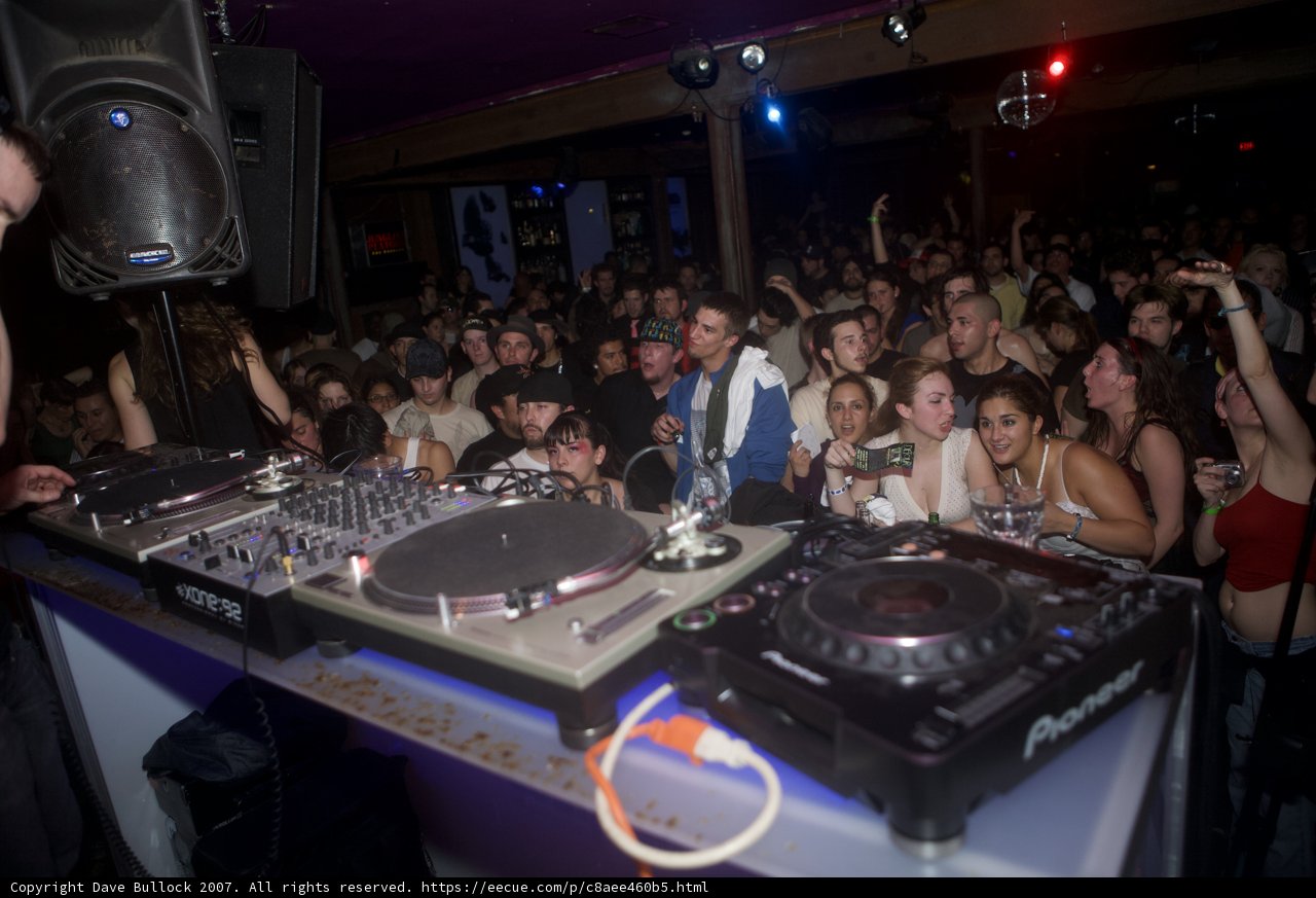 DJ Entertaining the Urban Crowd at Nightclub