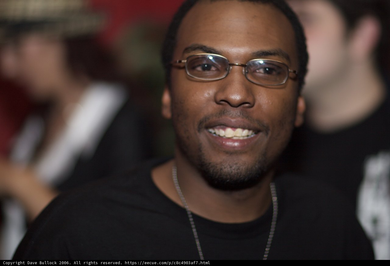Black-clad Smiling Man