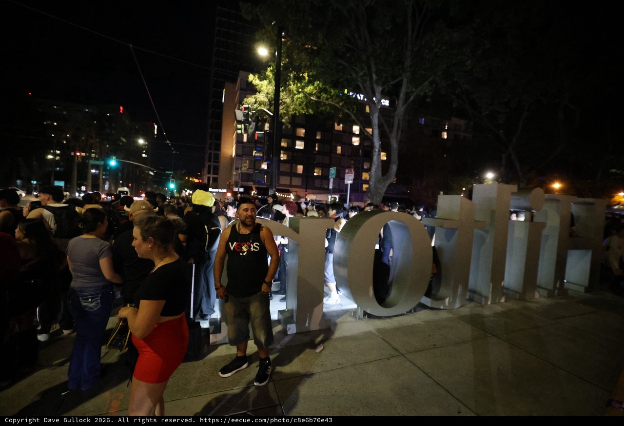 Late Night Festival Crowd Gathers Around Large Sign