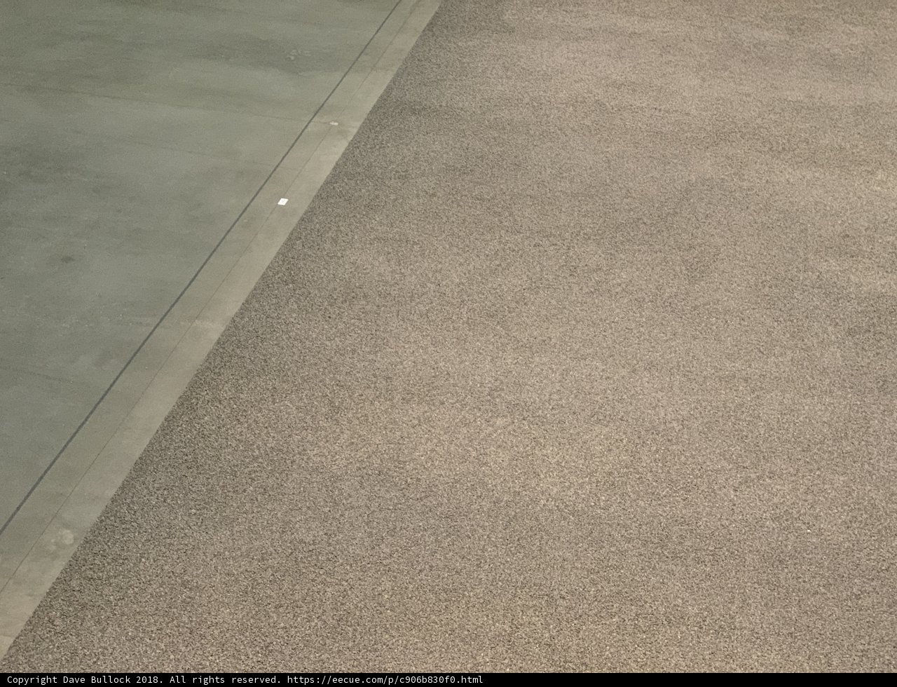 The Textured Flooring of a Glass Doorway