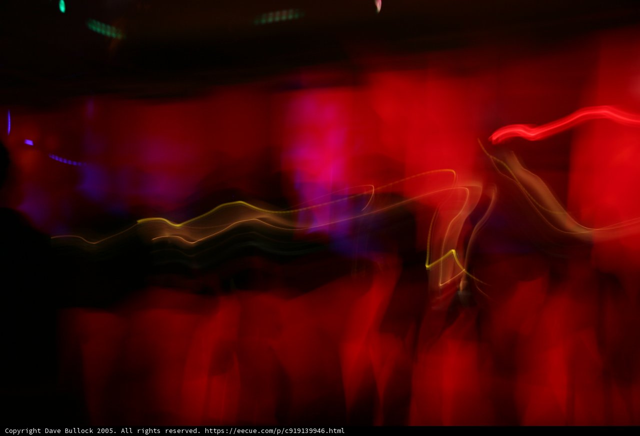 Blurred Nightclub Lights and Dancing Figures