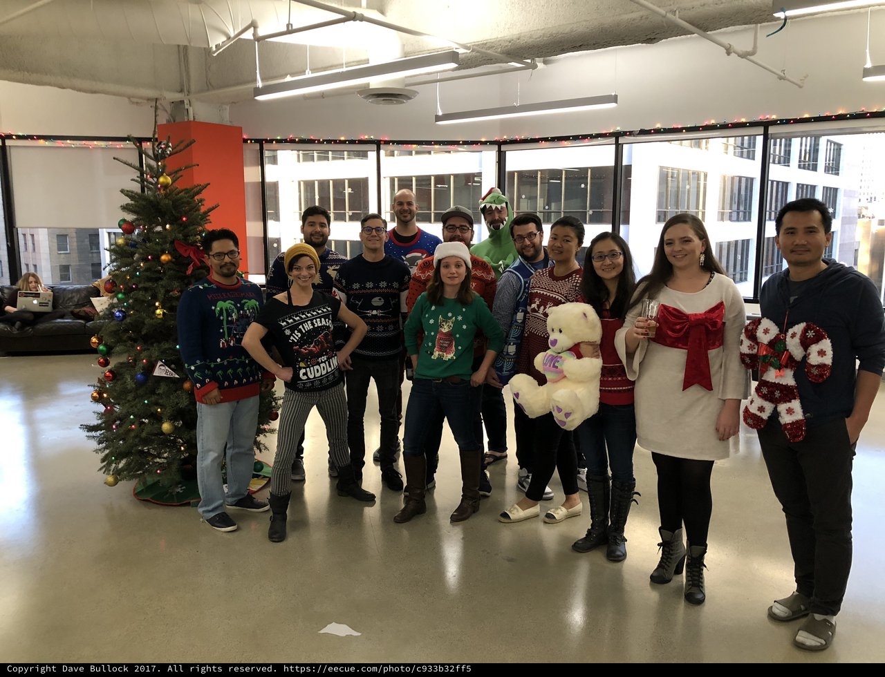 Office Team Celebrates Christmas in Ugly Sweaters