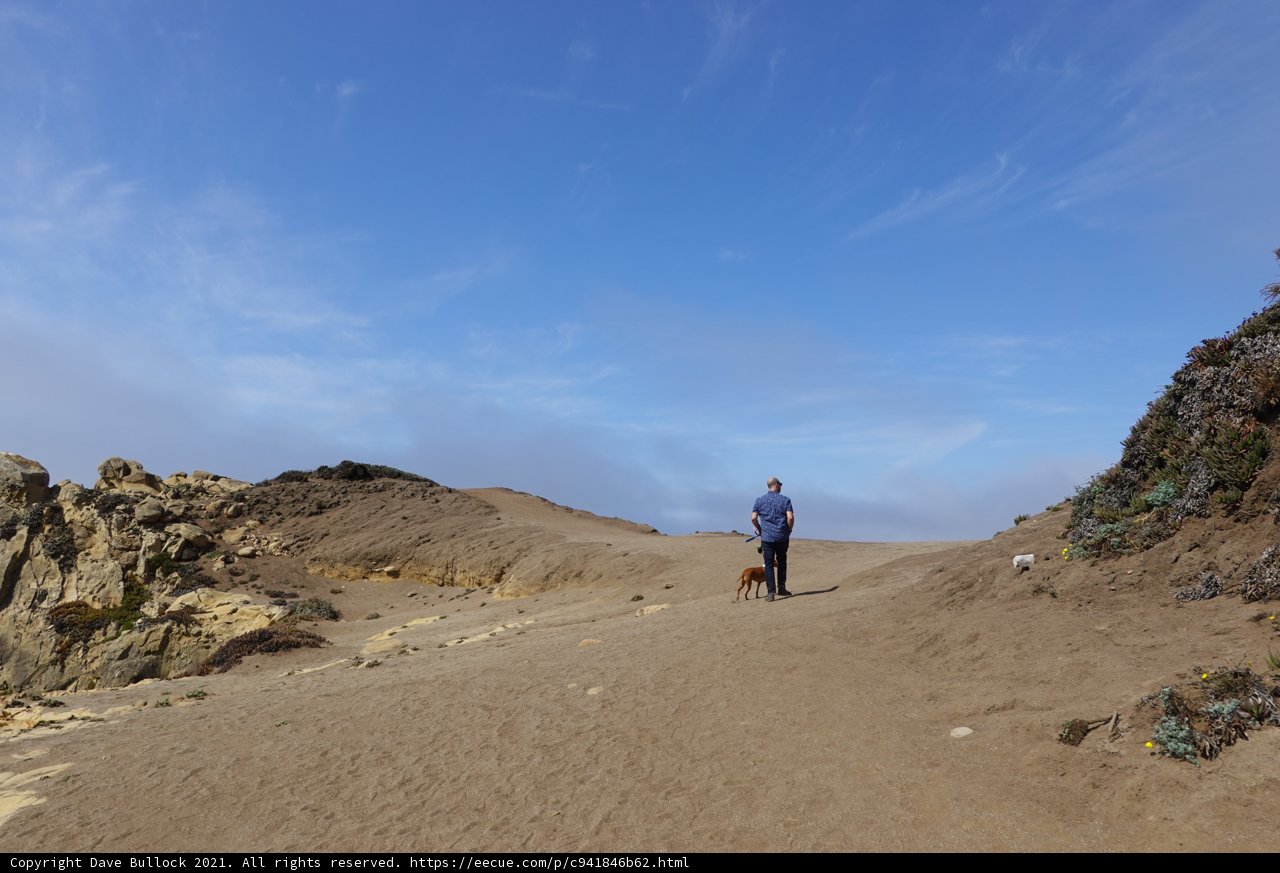 Man Taking a Hike in the Desert