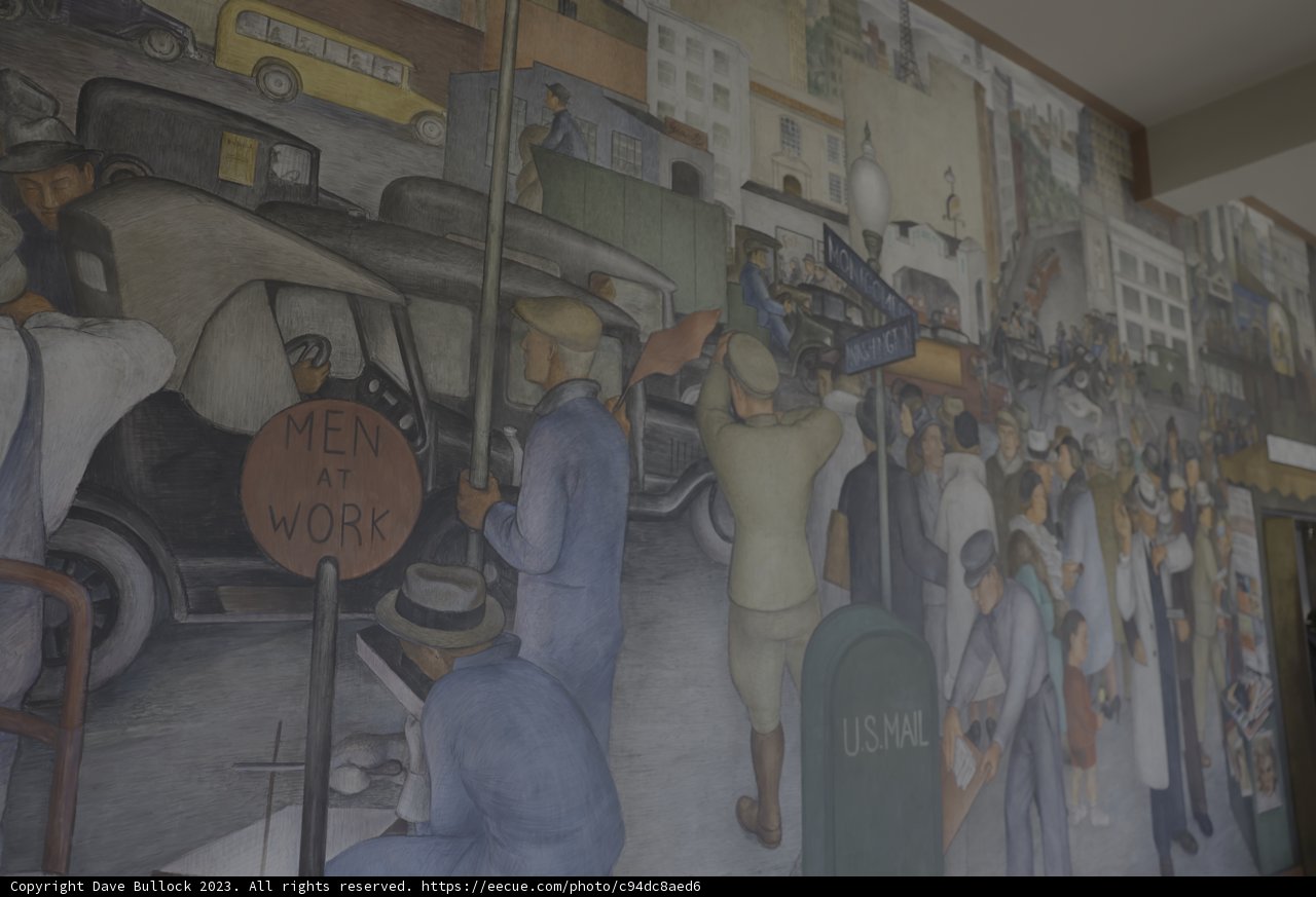 Colorful Mural of People and Cars in a Modern Building