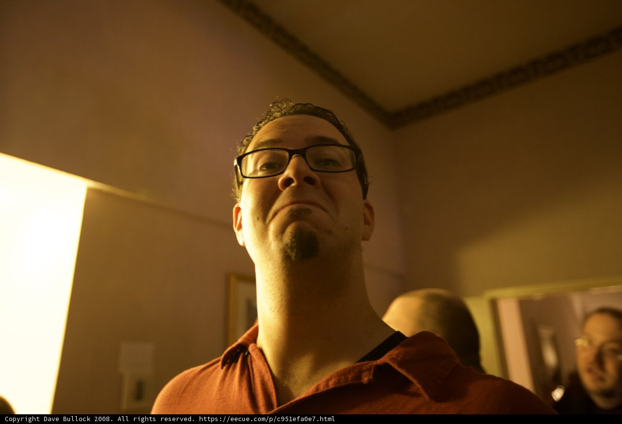 Red Shirted Man with Glasses