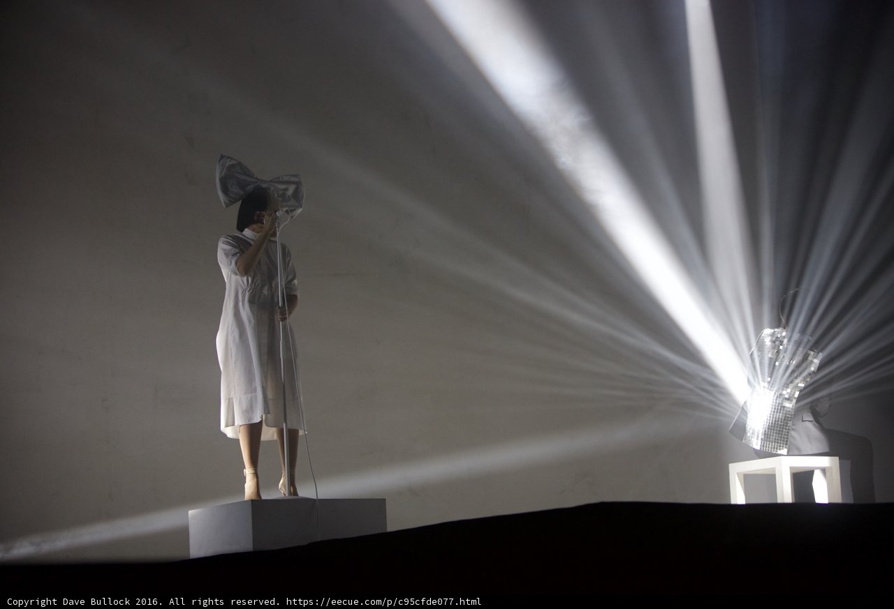 The White Dress Statue Shining in a Beam of Light