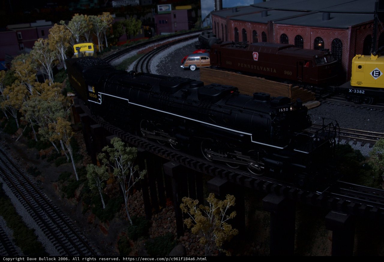 Three Toy Trains on a Railroad Diorama