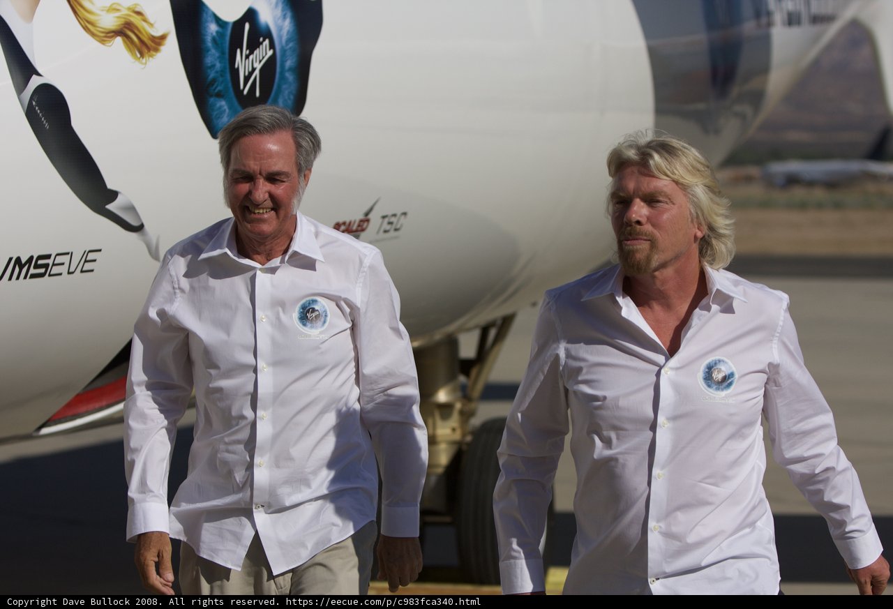 Richard Branson and Burt Rutan Walking Next to Their Aircraft