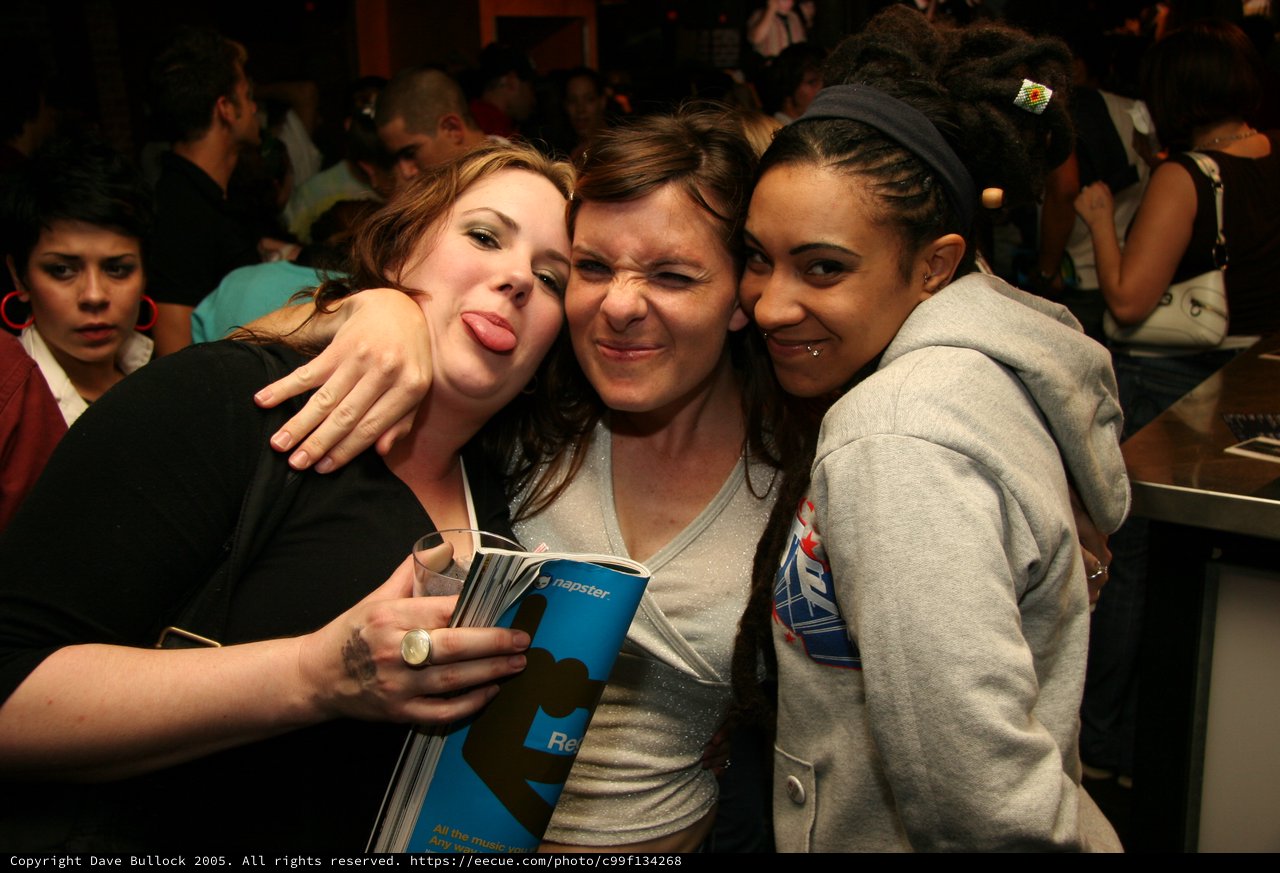 Three Friends Goofing Around at a Napster Party