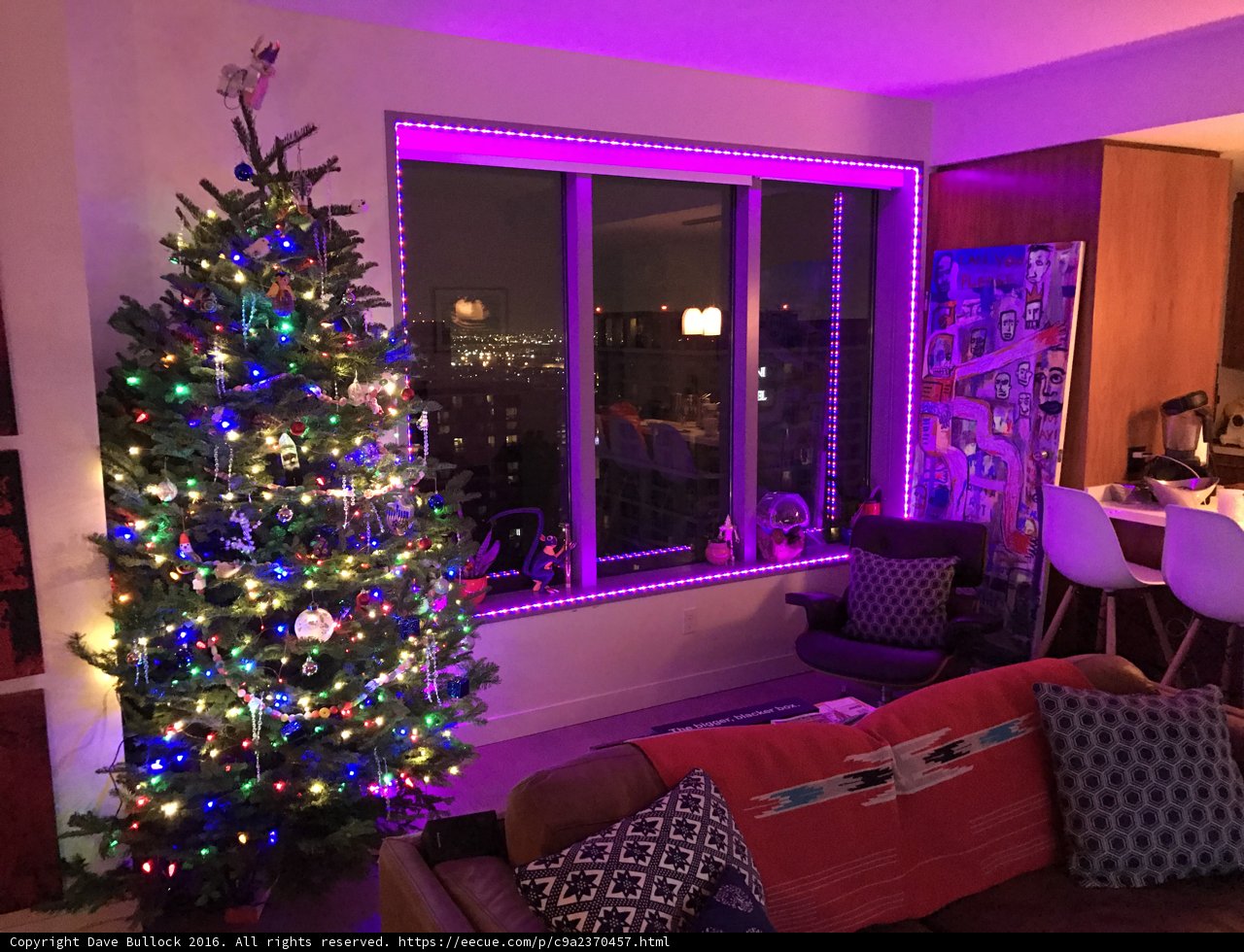 Purple Glowing Christmas Tree in a Festive Living Room