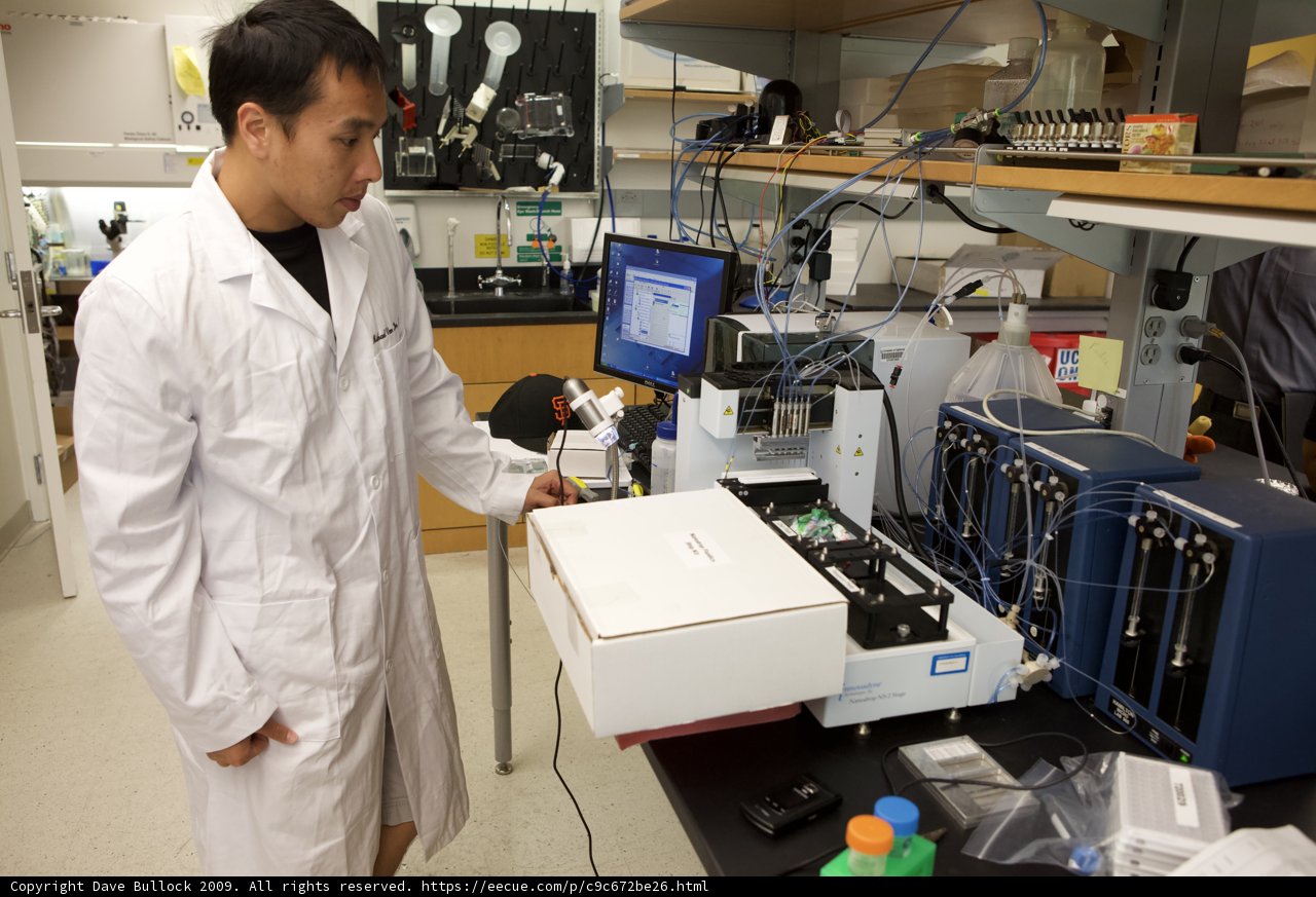 Lab Coat Scientist Working with Micro Bio Chips