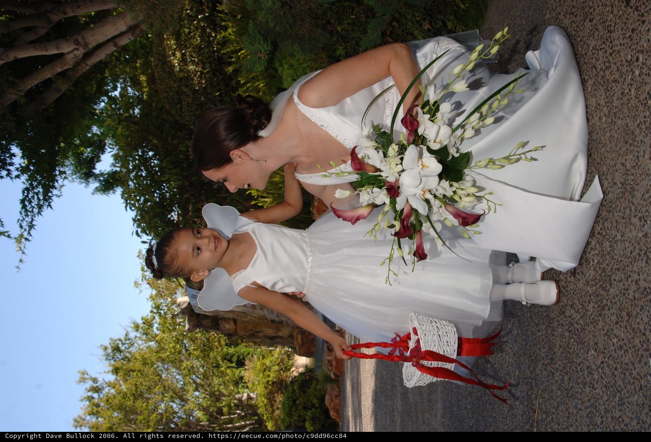 Bride and Flower Girl Share a Tender Wedding Moment