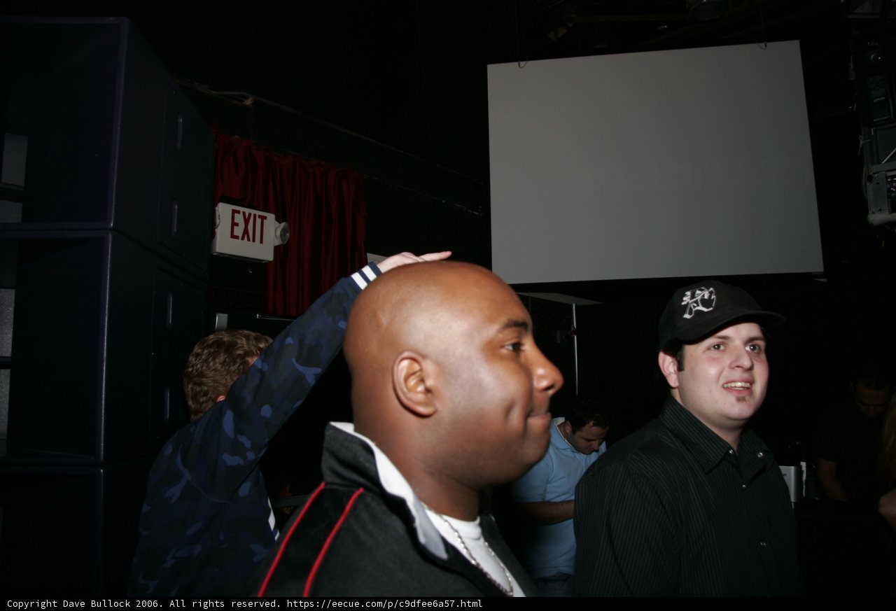 Black-Jacketed Man in Ball Cap