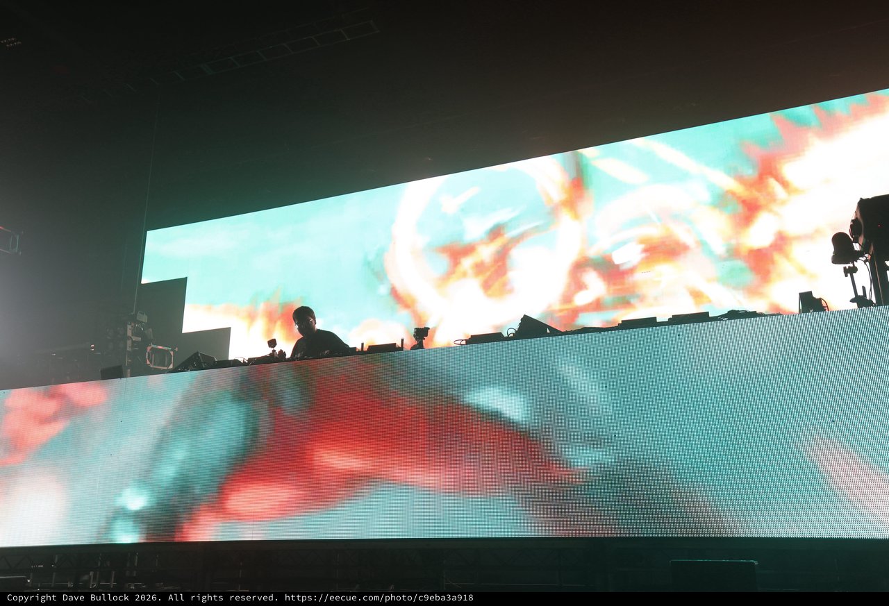 DJ Silhouette Against Massive LED Stage Display