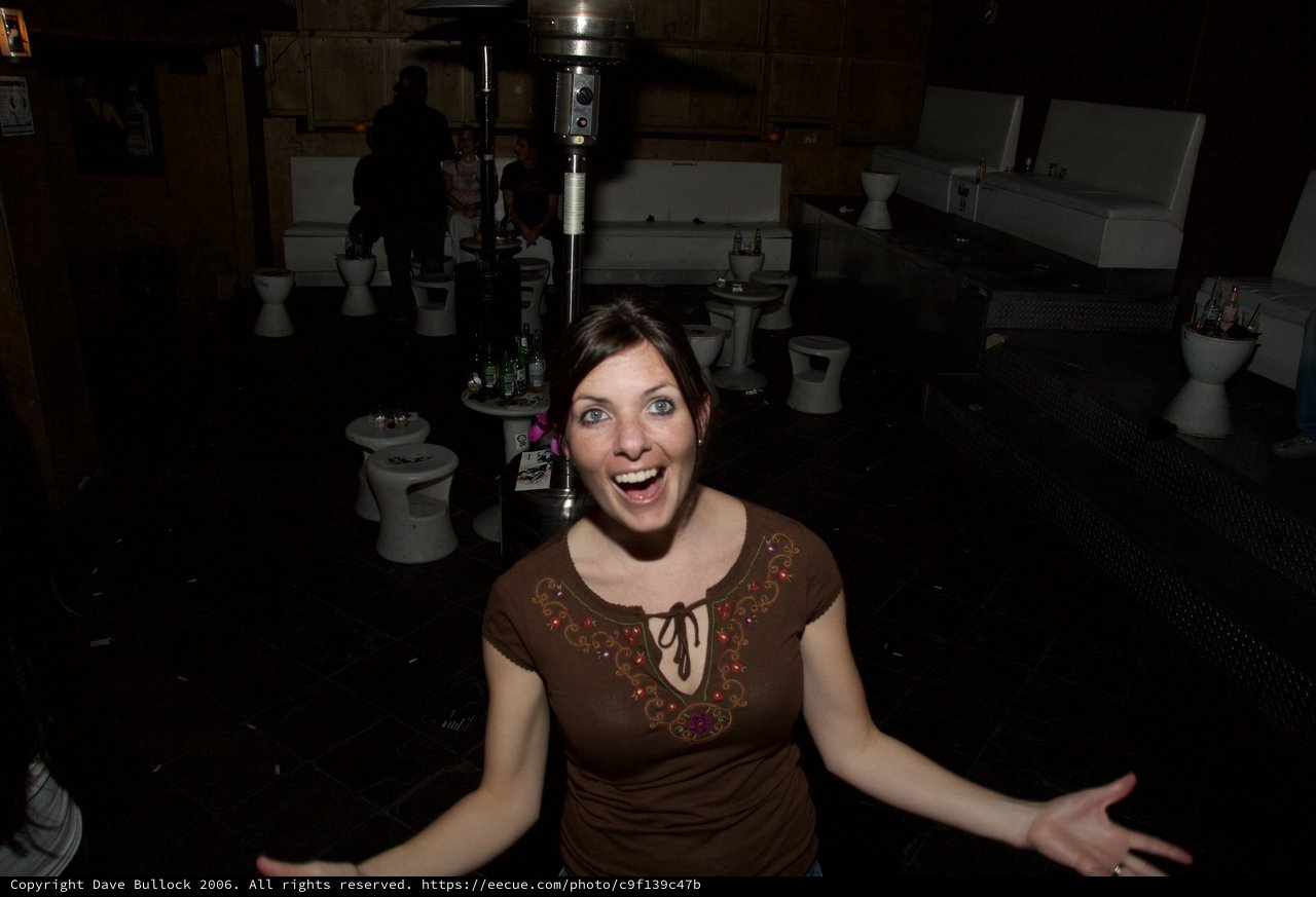 Excited Woman Celebrates at Nightclub Party 2006