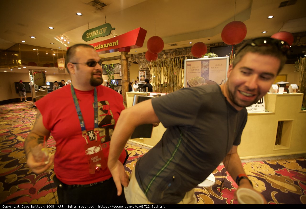 Two Men Enjoying a Night Out in a Casino