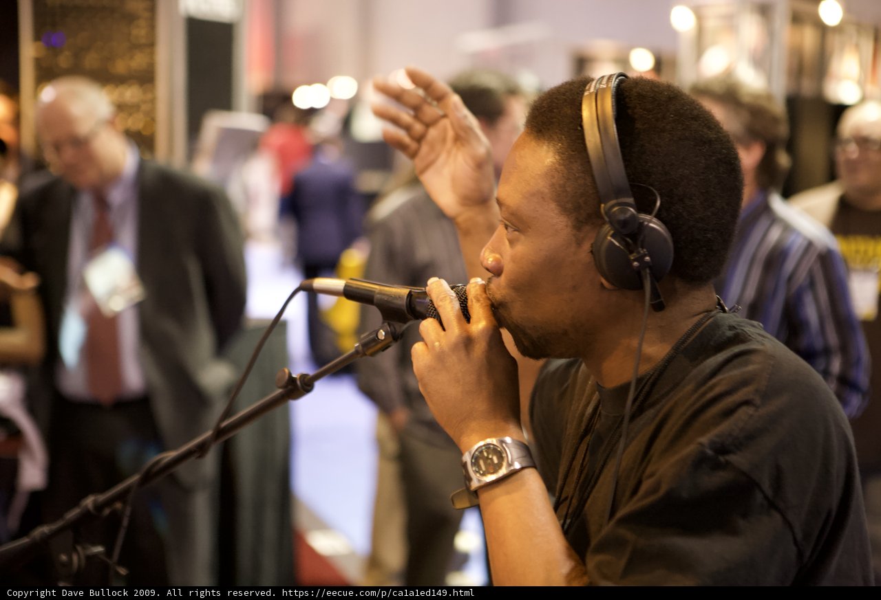 Musician Performing with Headphones and Microphone
