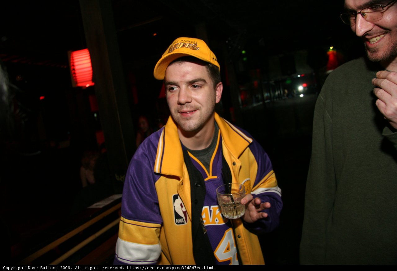 Lakers Fan enjoying a drink Caption: Lenny R shows off his Lakers gear while enjoying a drink at the pub in 2006.