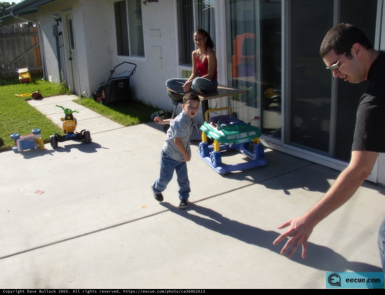 Father and Son Play Frisbee