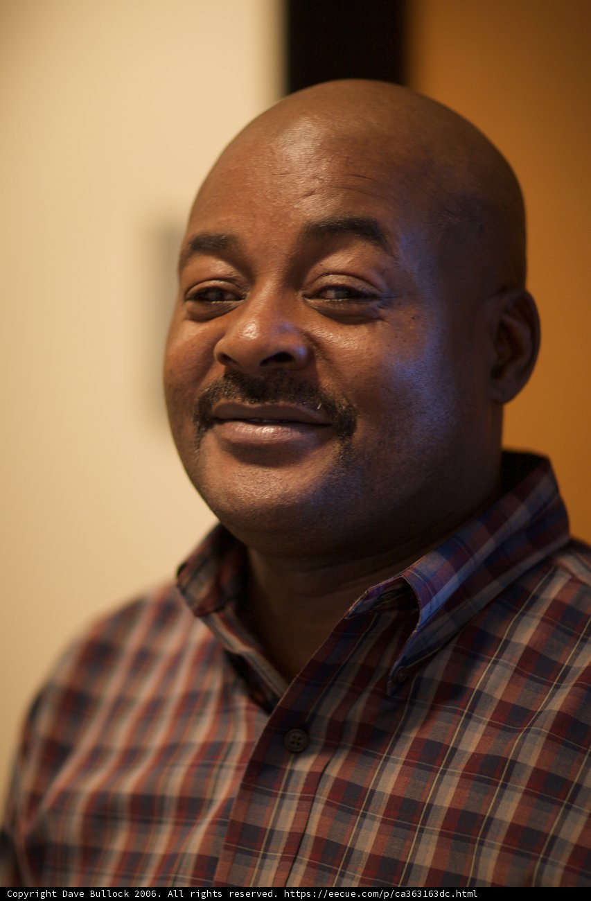 Happy Bald Man in Plaid Shirt