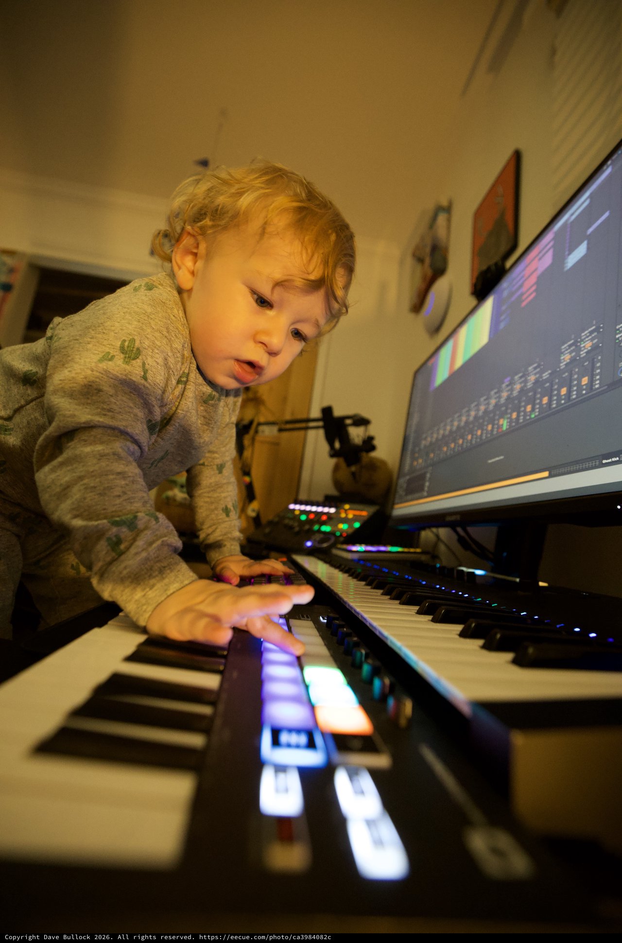Young Child Exploring Music Production at Home Studio