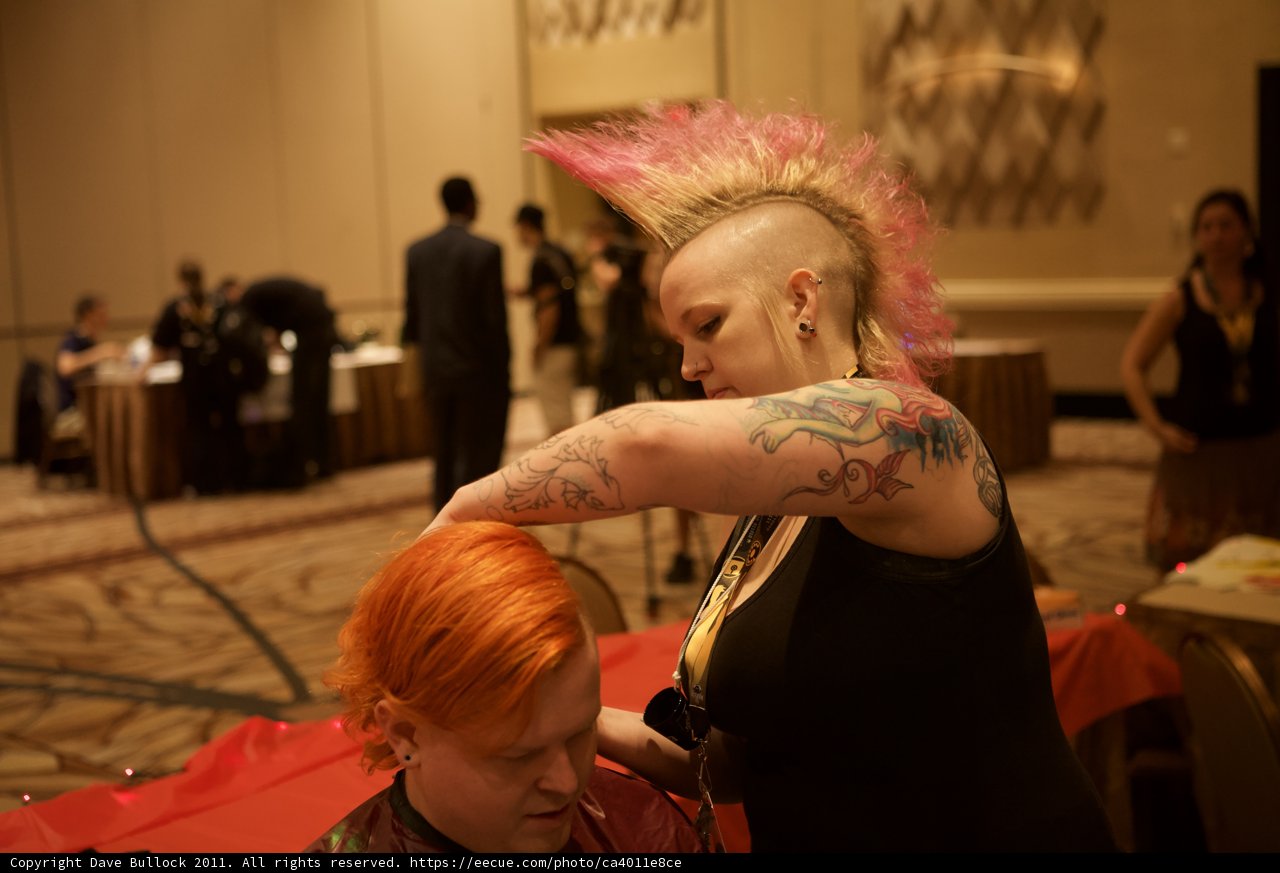 Pink-haired woman getting a tattoo