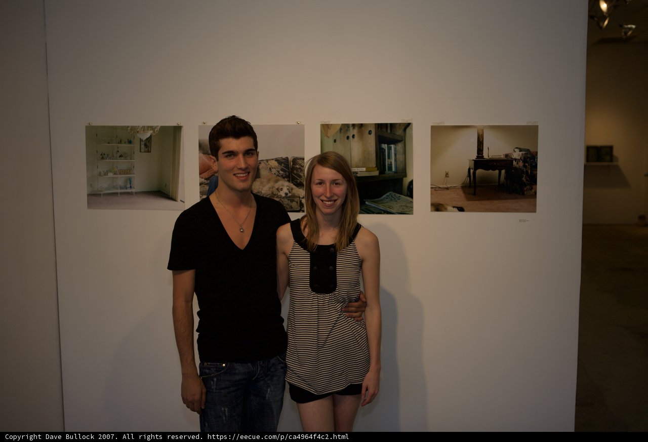 Posing in Front of Art Display