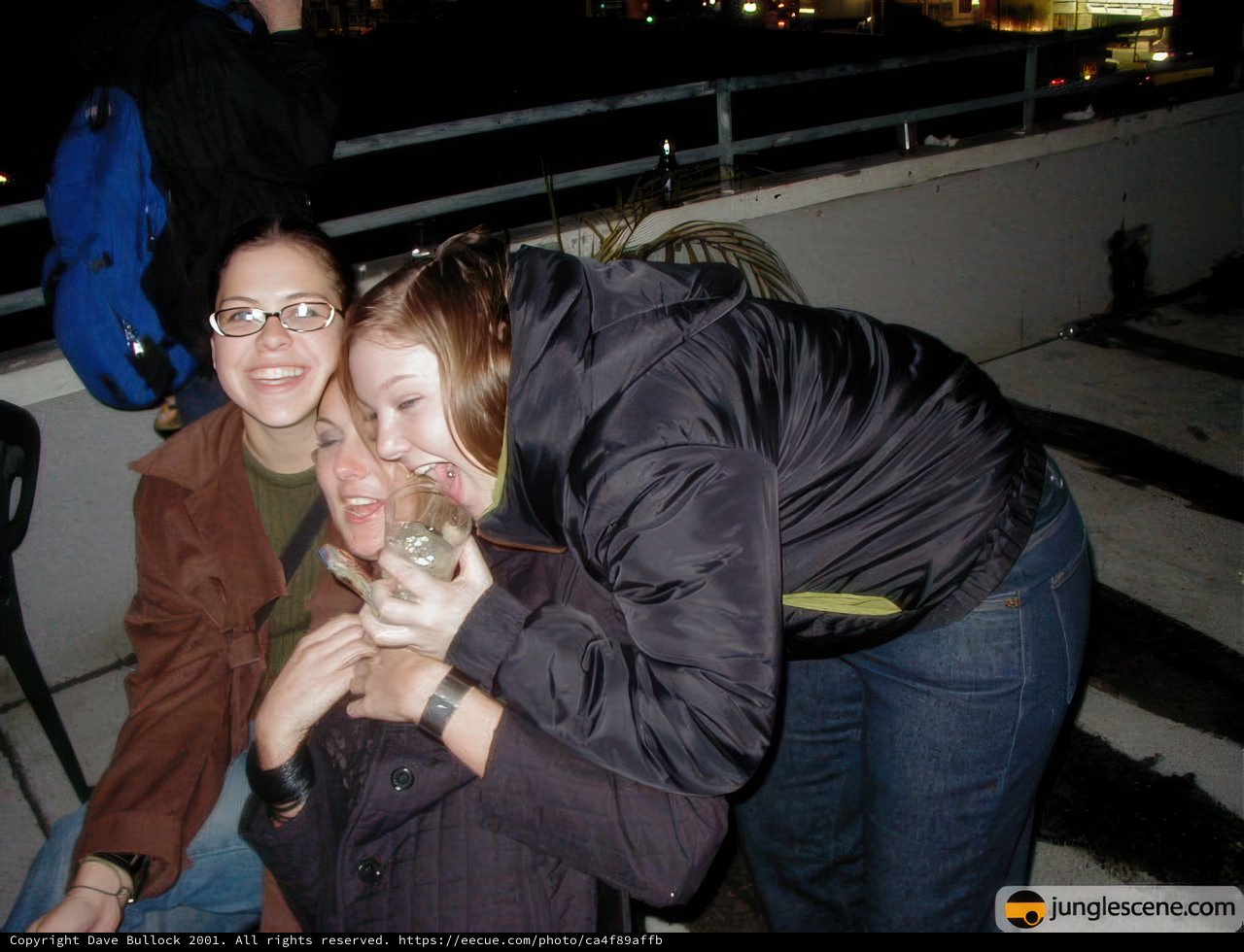Three Women Embrace on New Year's Eve