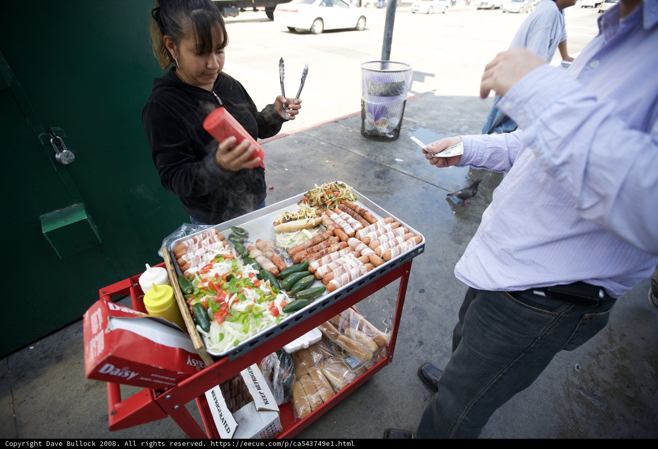 Man Grilling Meat at Indoor Restaurant