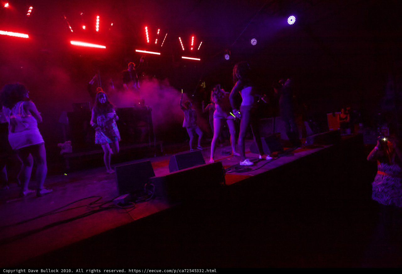Red Spotlight on a Crowded Stage