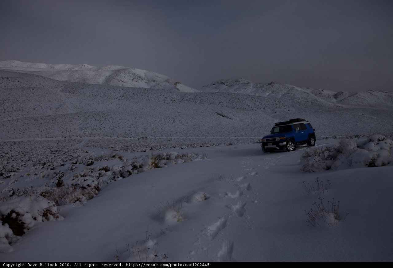 Blue SUV in the Snow