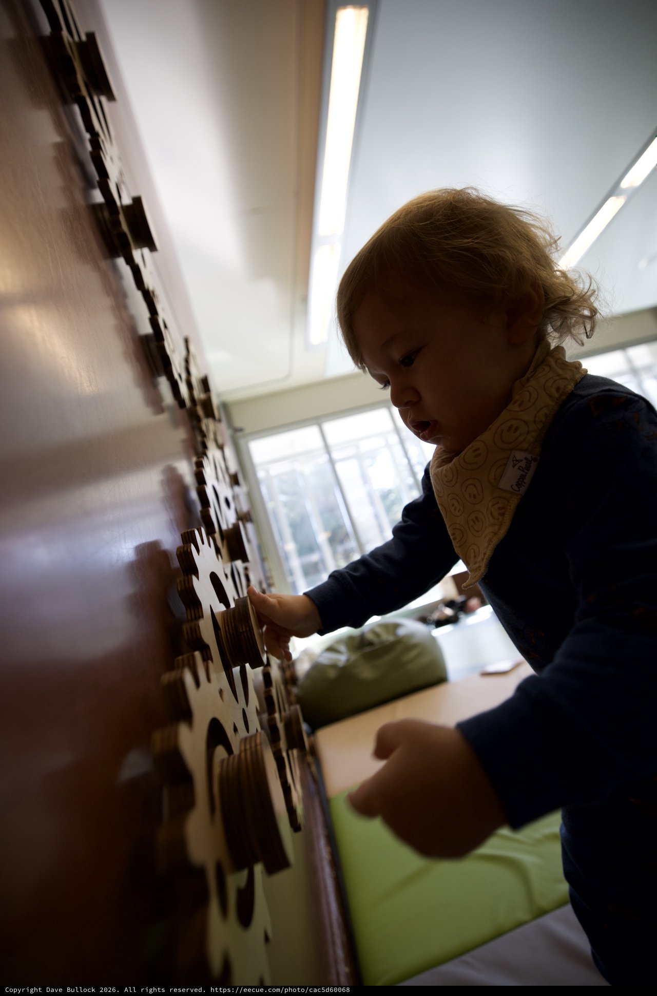 Young Child Engaged in Interactive Learning Play