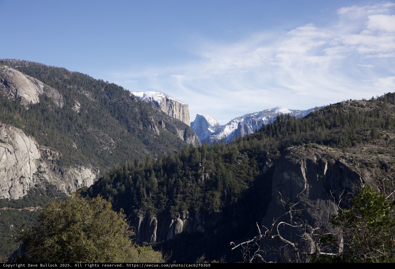 Snow-Capped Peaks Beyond Yosemite Valley Granite Cliffs