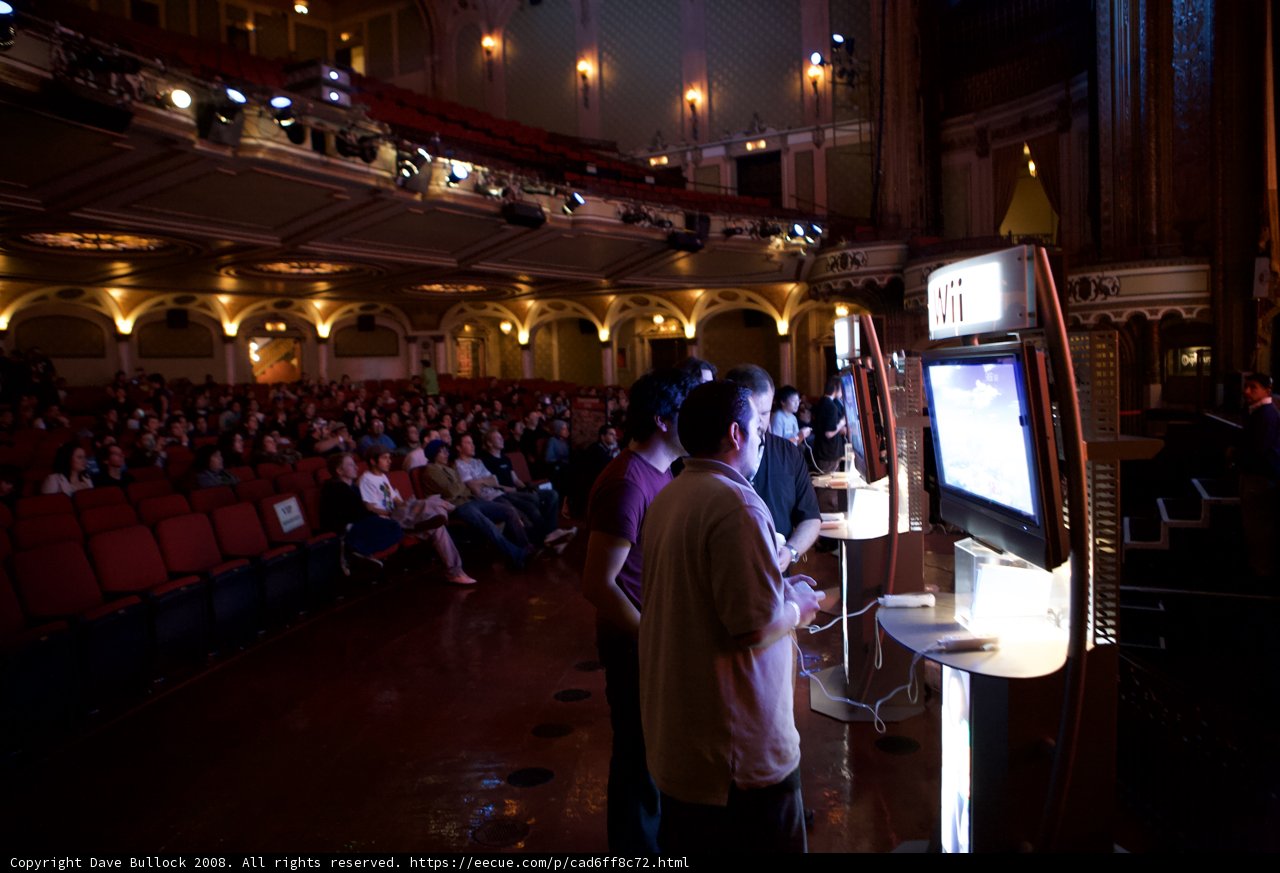 Man Standing in Front of Giant Screen at Orpheum Auditorium