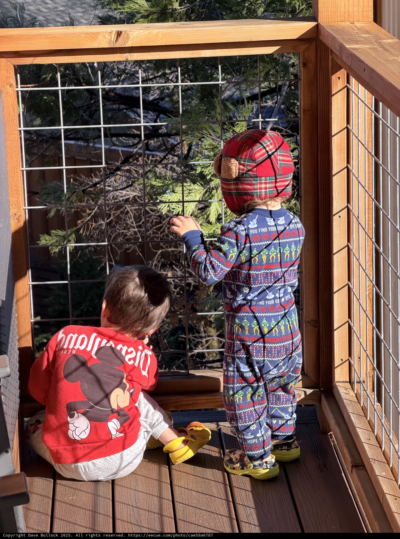 Two Children Exploring Snowy Yosemite Deck Together