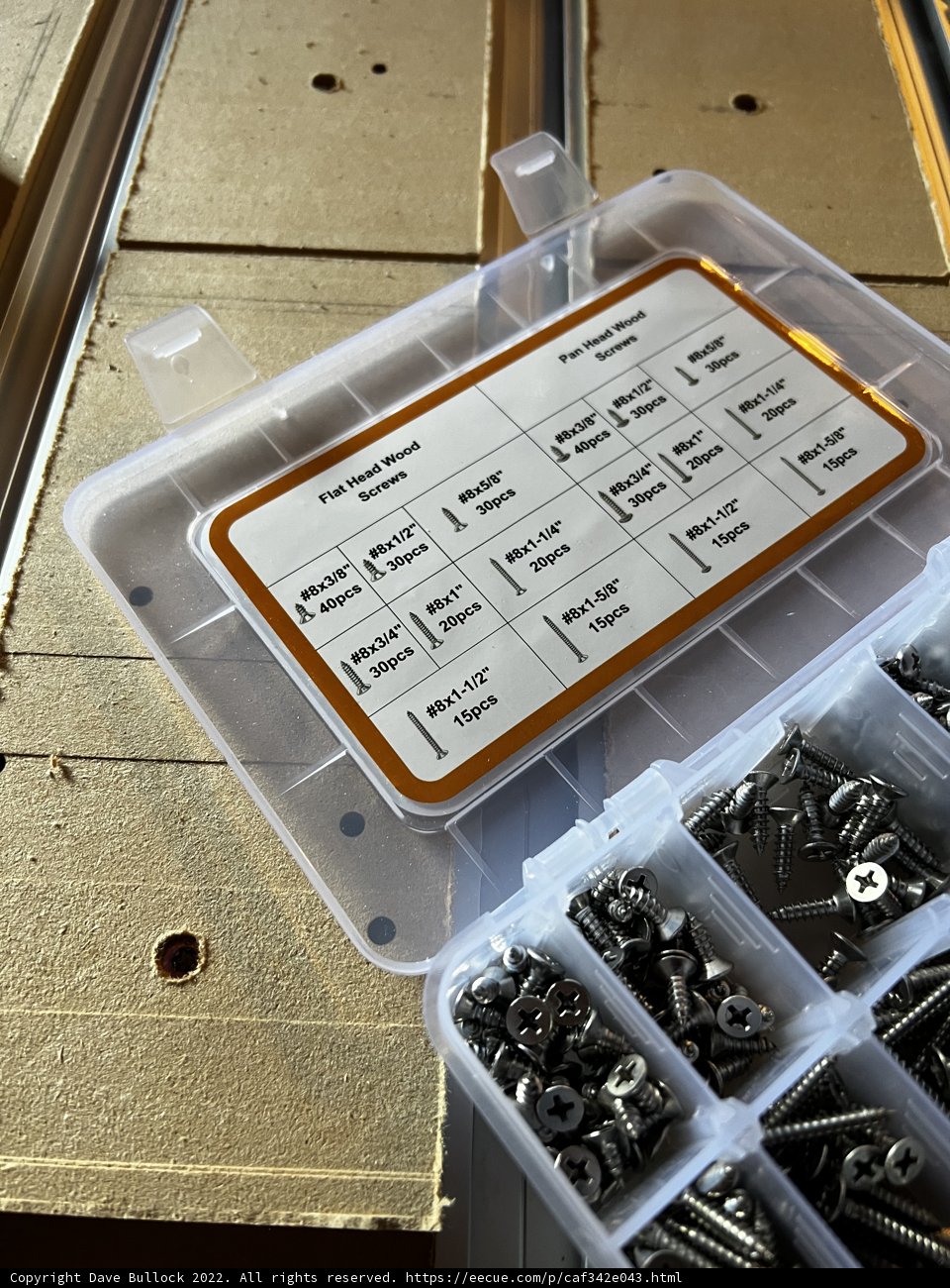 Assorted Hardware Screws and Nuts in a Plastic Box