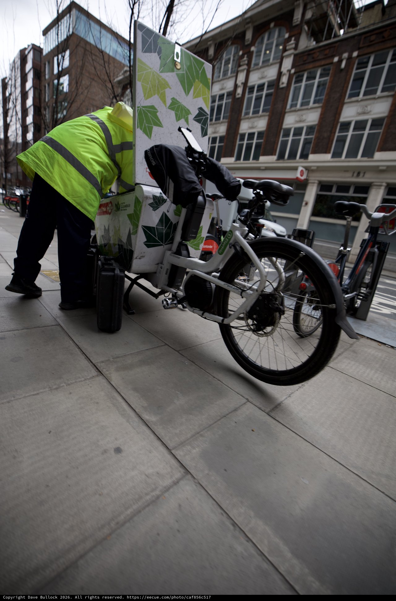 Delivery Cyclist Navigating Urban Streets in Hi-Vis Gear