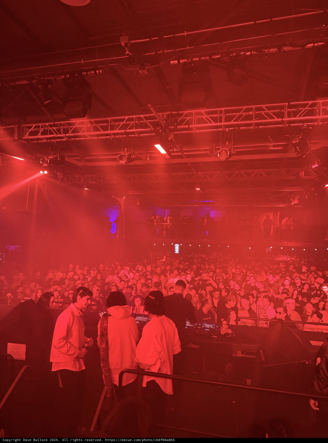 Electronic Music Concert Under Dramatic Red Stage Lighting
