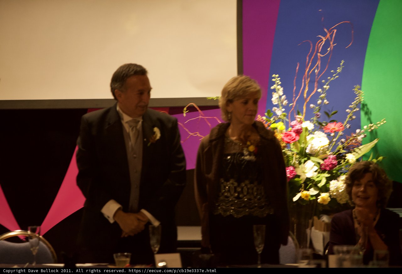 Wedding Guests Admiring Flower Arrangement