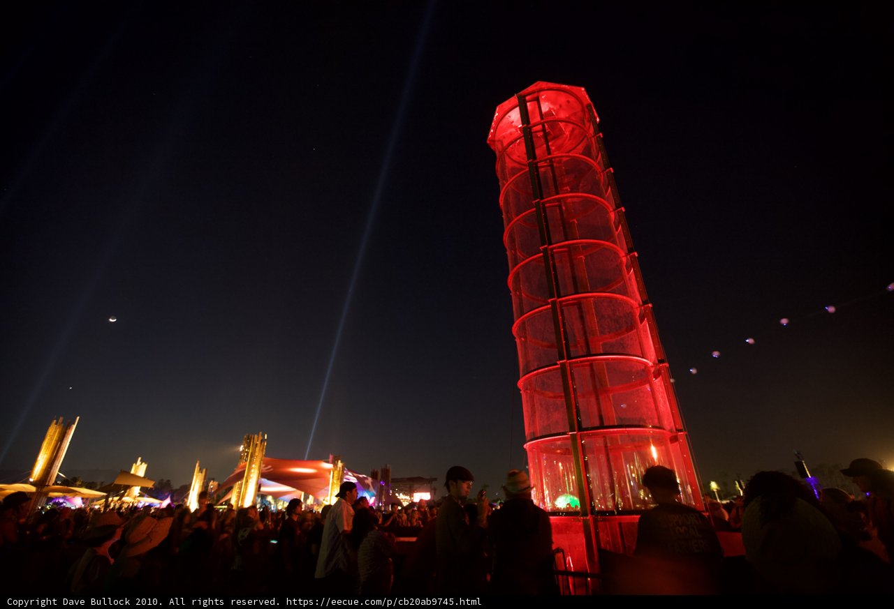 Red Tower Illuminates Urban Night Life
