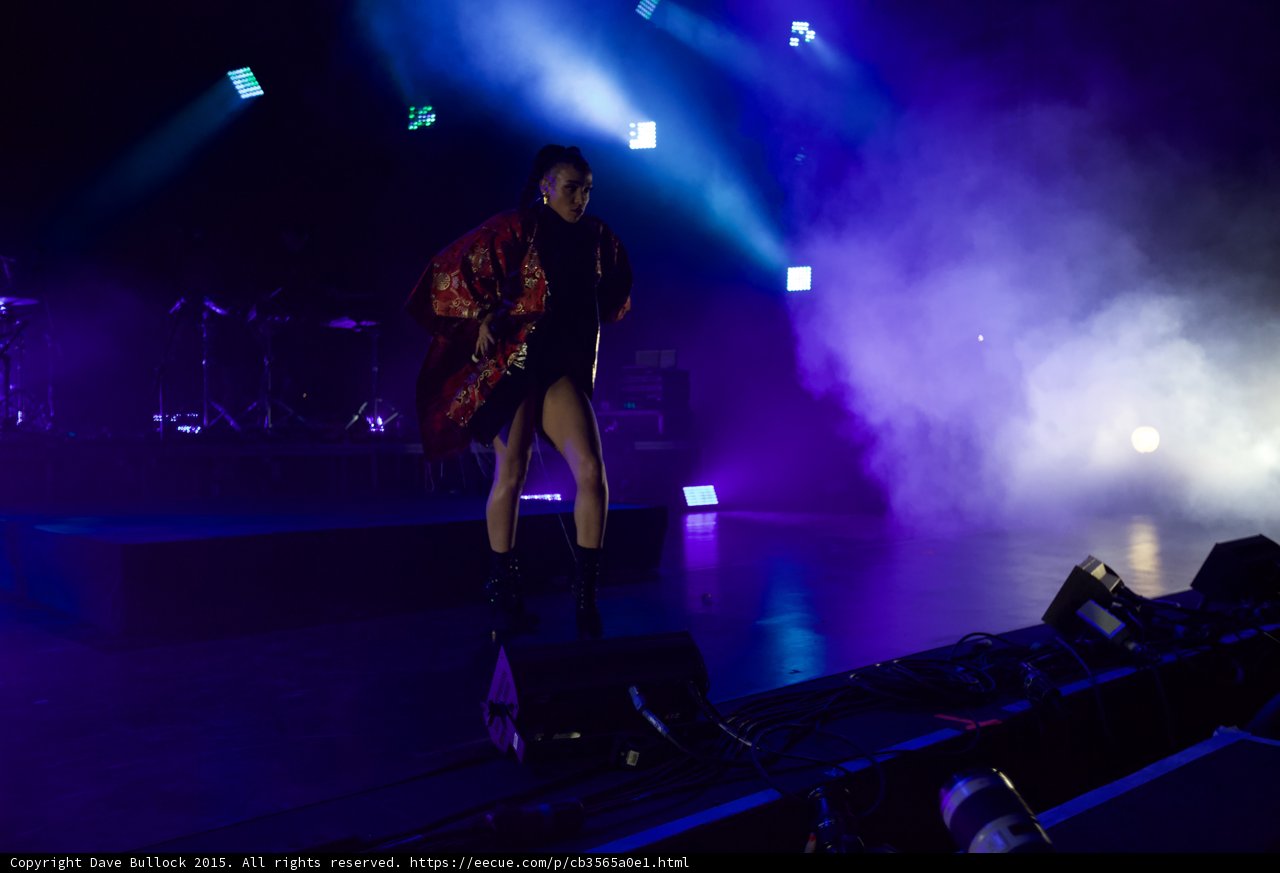 FKA twigs Full Body Wide Blue Purple Lighting Powerful Stance Legs Apart Red Brocade Kimono Flowing Black Bodysuit Boots Moon Band Haze
