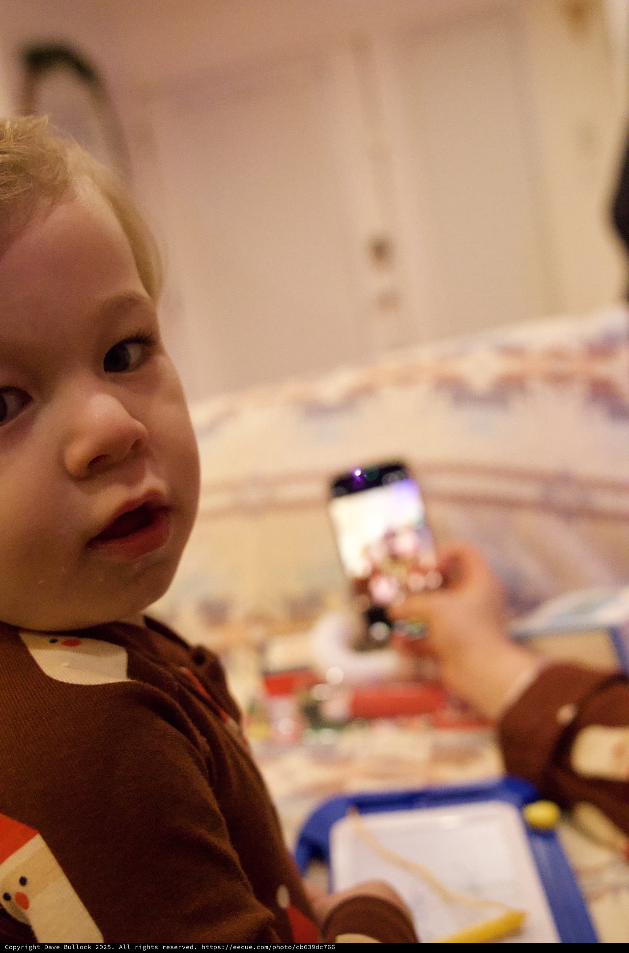 Young Child Playing with Drawing Toy on Christmas