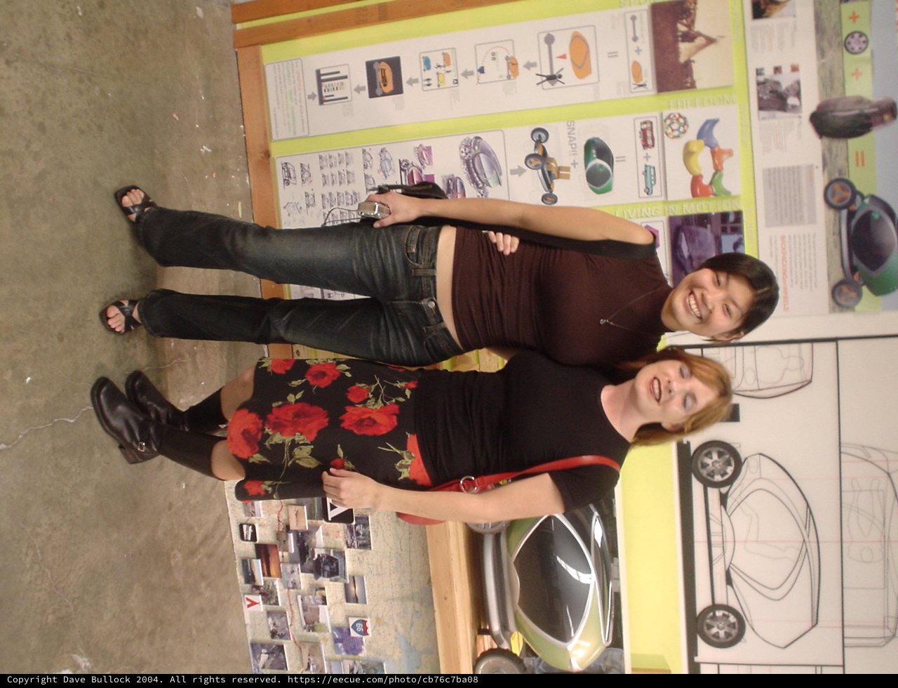 Two Women Laughing at Car Design Exhibition 2004