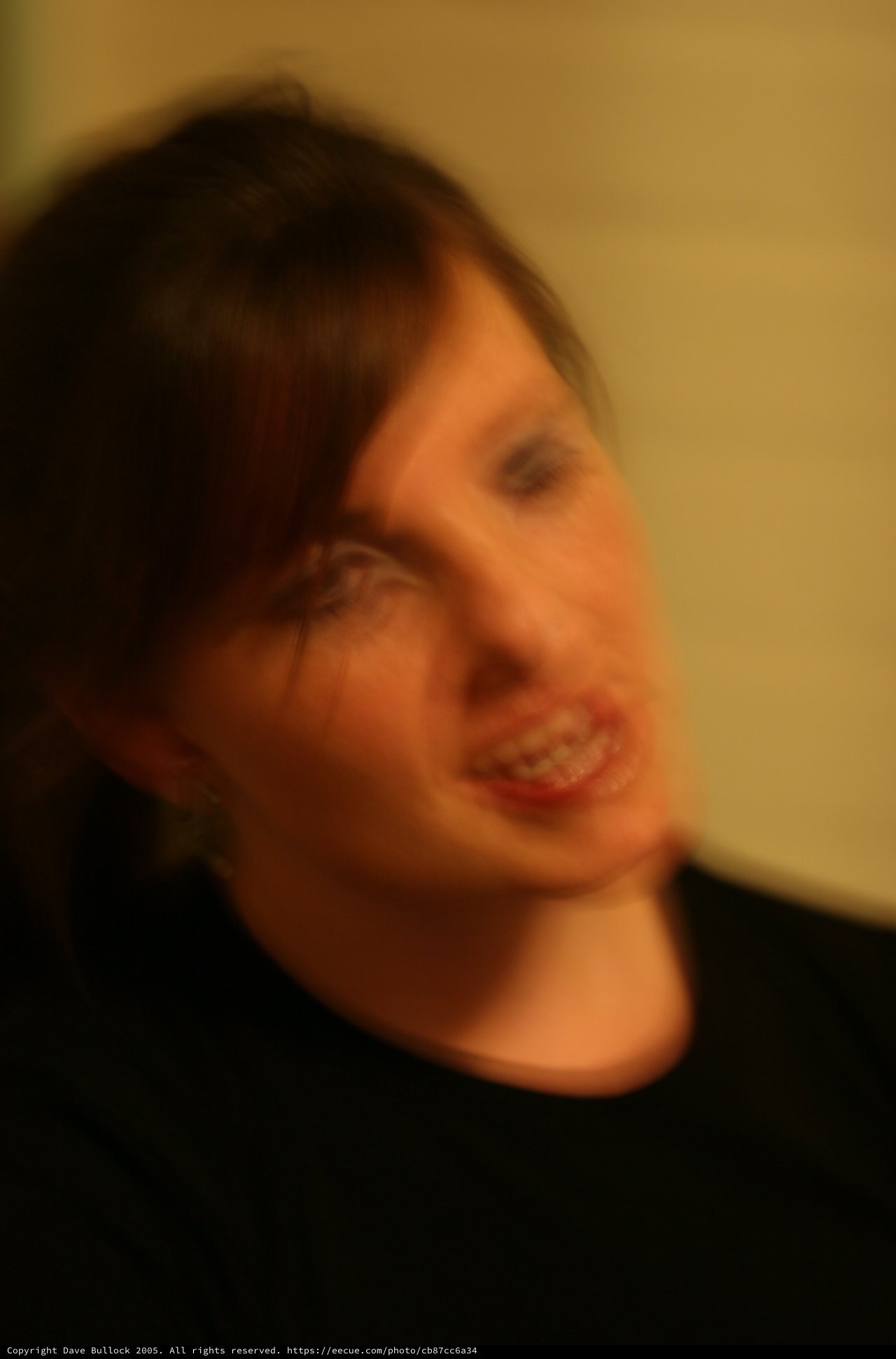 Motion Blur Portrait of Smiling Woman in Warmth